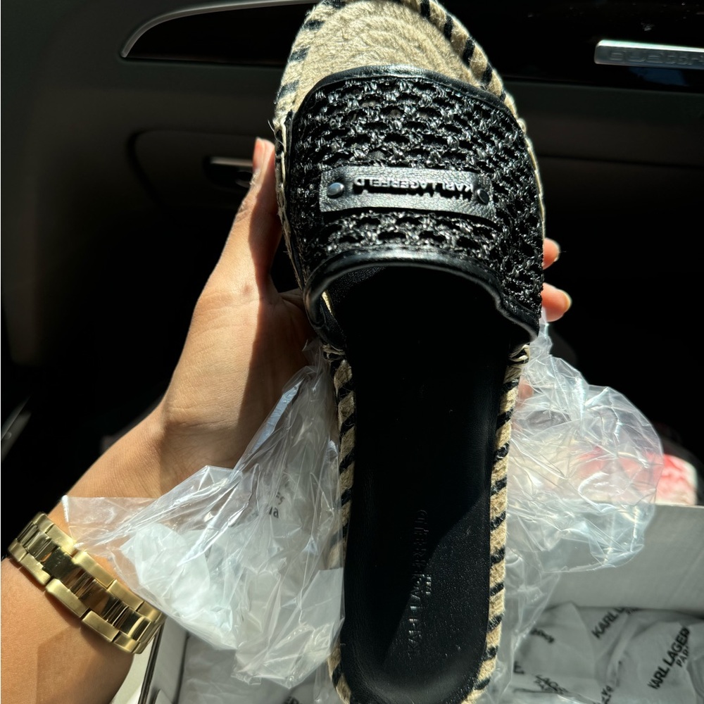 Super New.Selling it because of the size issue. Karl Lagerfeld Brand.